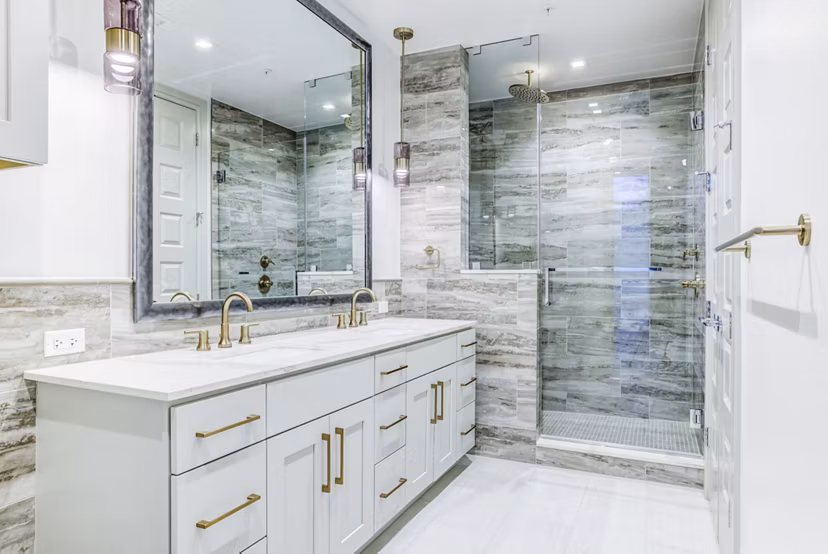 Luxury bathroom with modern fixtures at The Bowen Apartments, offering elegance and comfort in a Greystar community