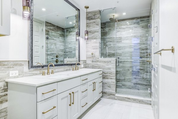 Luxury bathroom with modern fixtures at The Bowen Apartments, offering elegance and comfort in a Greystar community