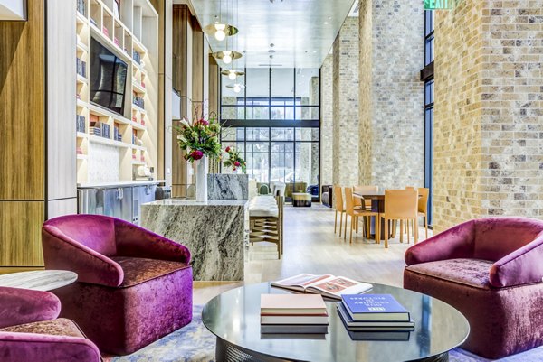 Clubhouse lobby with modern design and seating area at The Bowen Apartments