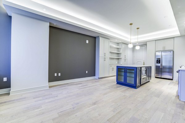 Spacious dining room with modern furnishings at The Bowen Apartments, perfect for hosting gatherings in Greystar's luxury living spaces