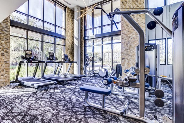 Fitness center with modern equipment at The Bowen Apartments