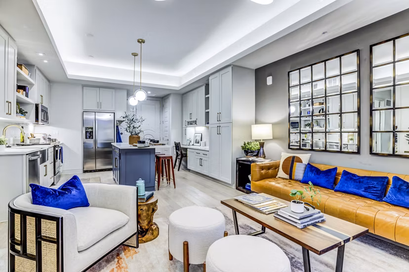 Spacious living room with modern decor at The Bowen Apartments, a luxury Greystar property