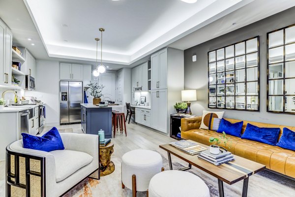 Spacious living room with modern decor at The Bowen Apartments, a luxury Greystar property