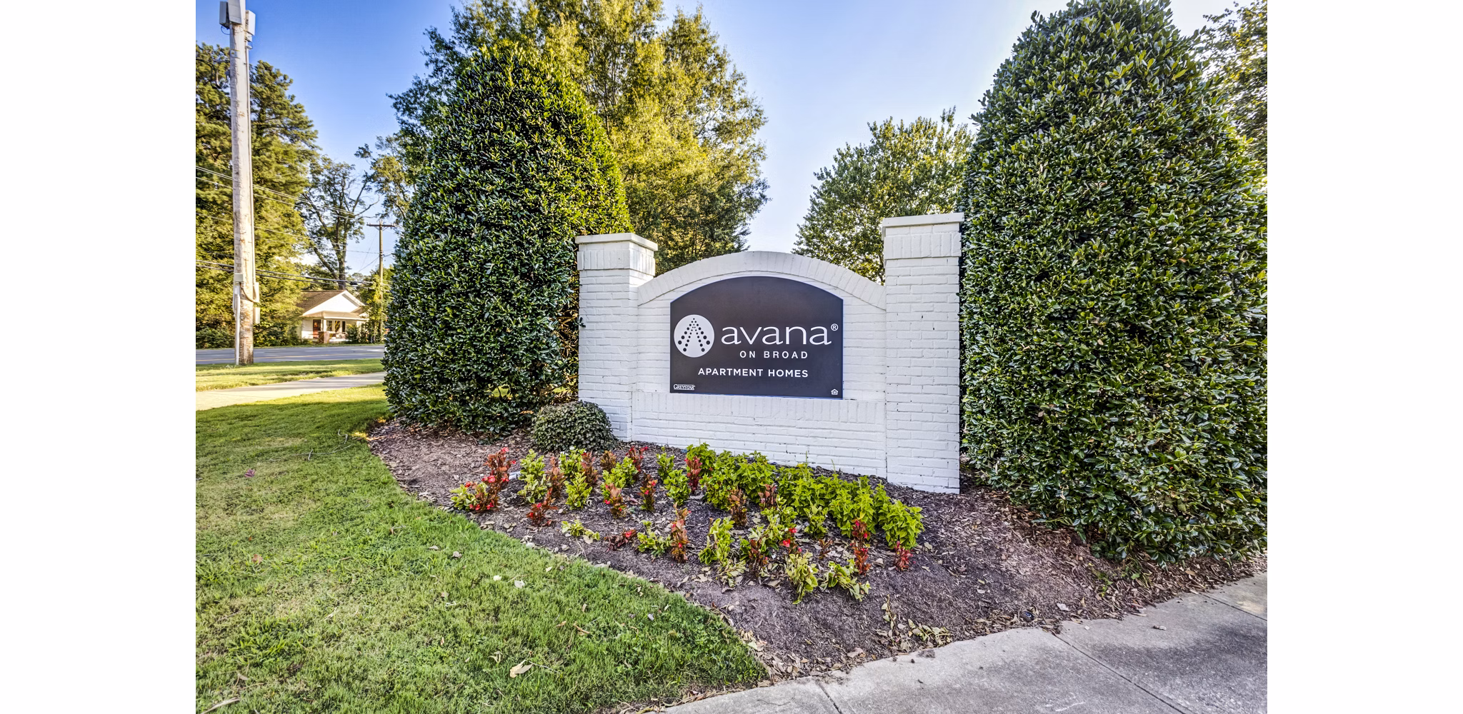 Avana on Broad Apartments signage showcasing luxury living in a serene environment