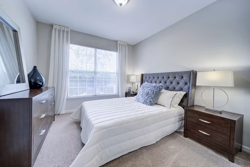 Spacious bedroom with elegant decor at Avana on Broad Apartments