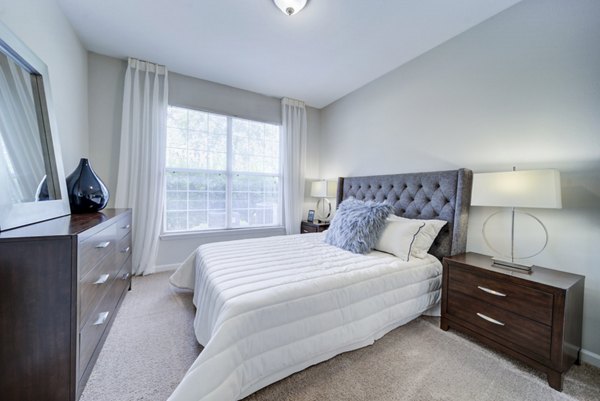 Spacious bedroom with elegant decor at Avana on Broad Apartments