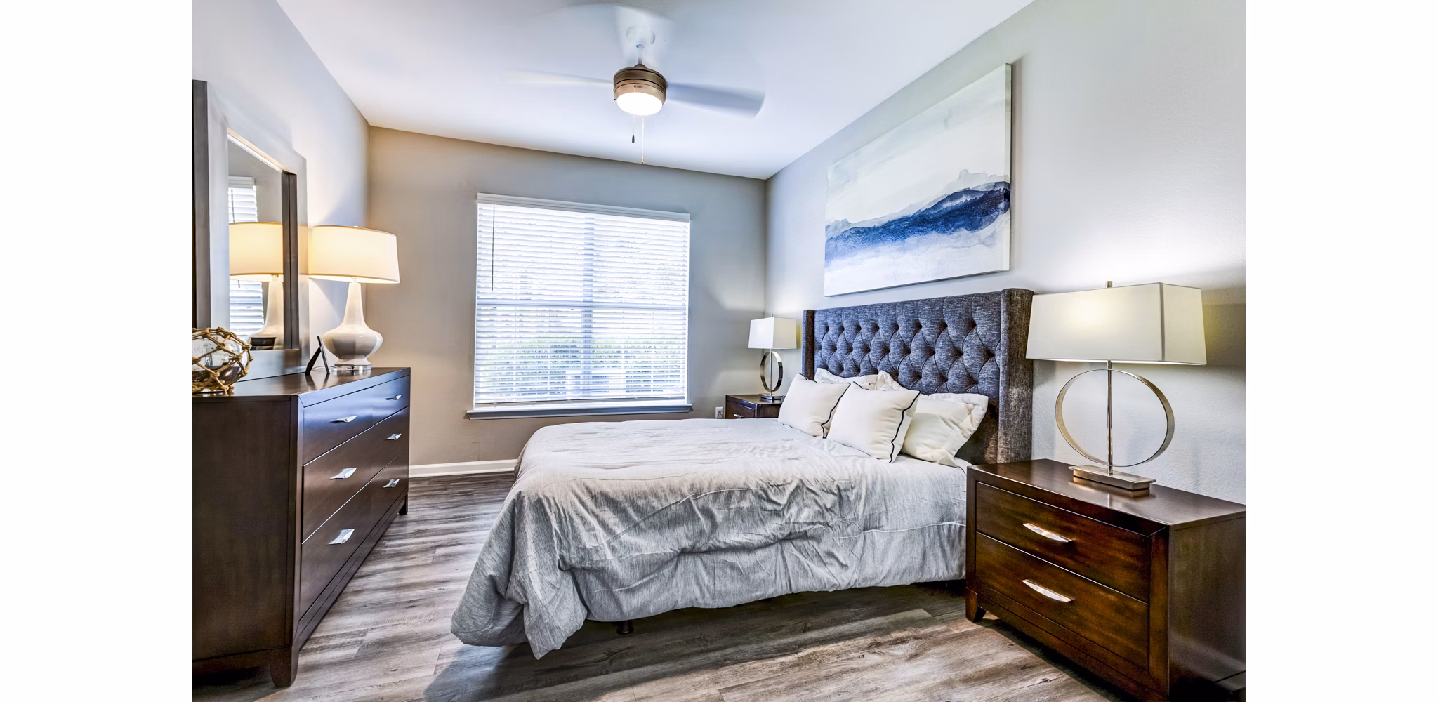 Cozy bedroom with plush bedding at Avana on Broad Apartments