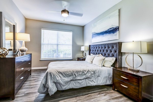 Cozy bedroom with plush bedding at Avana on Broad Apartments