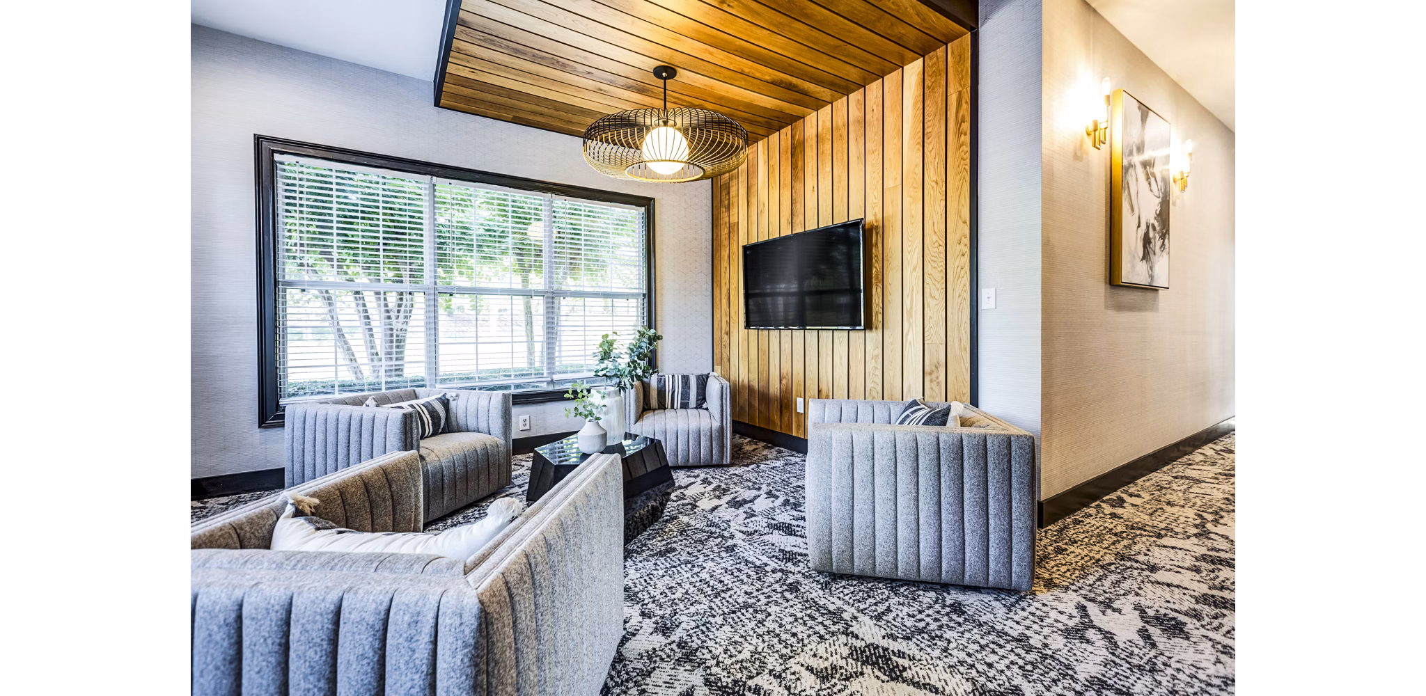 Clubhouse lobby featuring contemporary decor and modern seating at Avana on Broad Apartments
