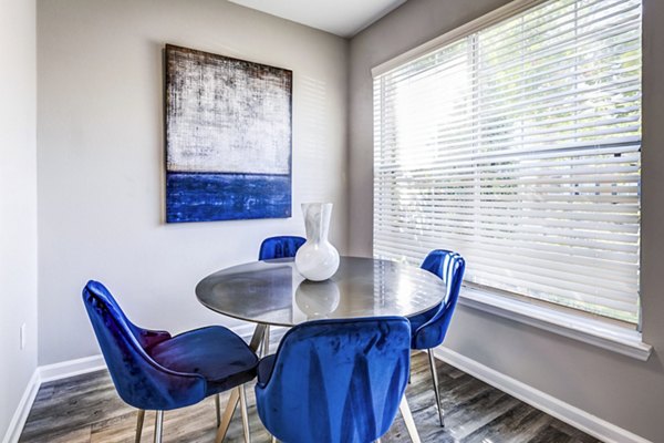 Elegant dining room with modern furnishings at Avana on Broad Apartments, showcasing stylish living in a luxury setting
