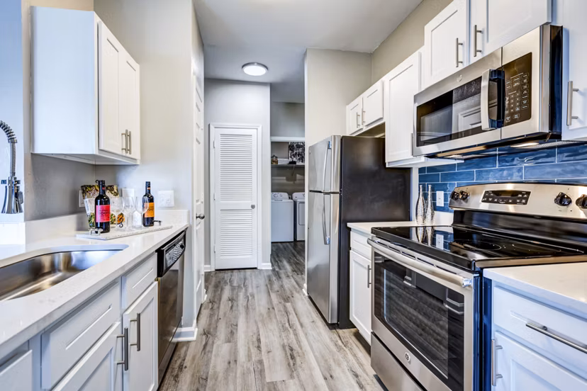 Modern kitchen featuring stainless steel appliances at Avana on Broad Apartments
