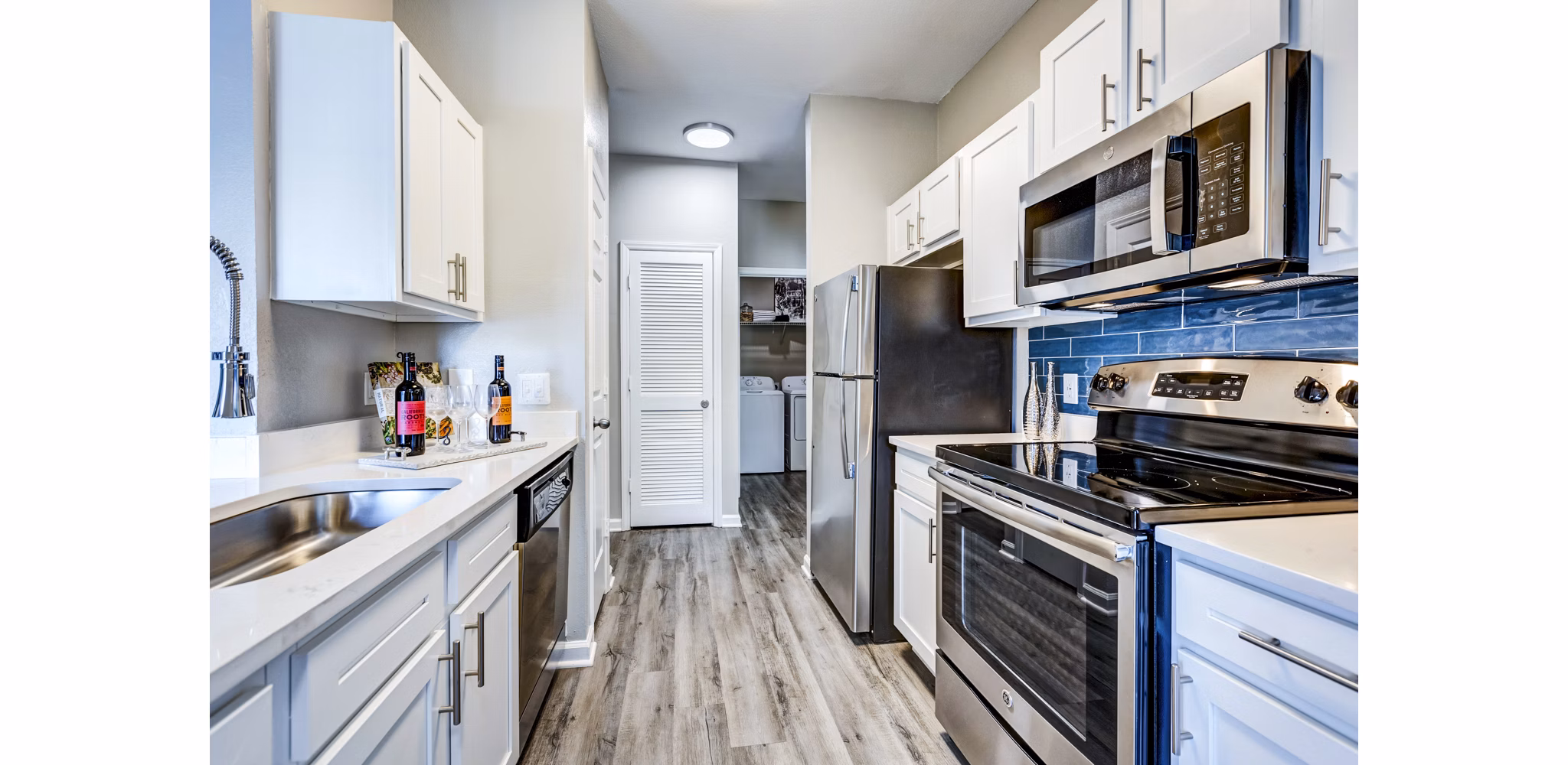 Modern kitchen featuring stainless steel appliances at Avana on Broad Apartments