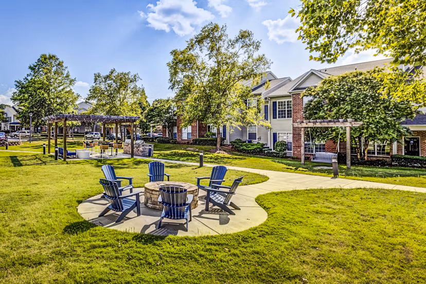 Cozy fire pit lounge area at Avana on Broad Apartments, perfect for relaxing evenings