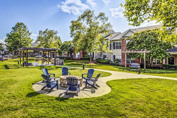 Cozy fire pit lounge area at Avana on Broad Apartments, perfect for relaxing evenings