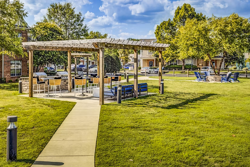 Grill area with modern patio furniture at Avana on Broad Apartments