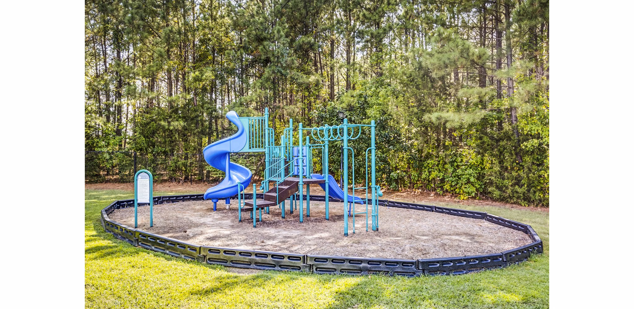 Playground area featuring modern play equipment at Avana on Broad Apartments