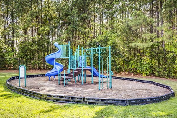 Playground area featuring modern play equipment at Avana on Broad Apartments