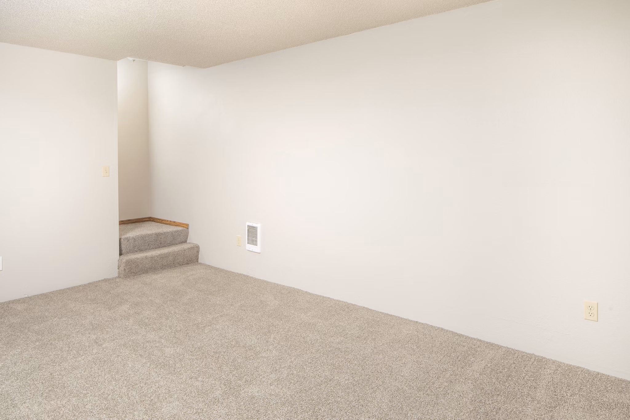 Living room with modern decor and plush seating at Veri at Timberhill Apartments