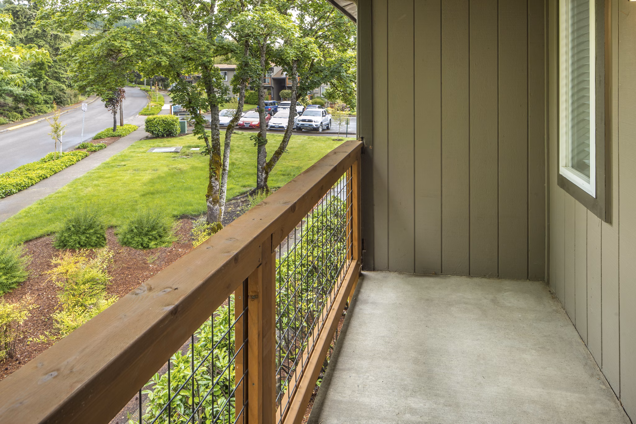 Veri at Timberhill Apartments: Elegant patio with outdoor seating and greenery