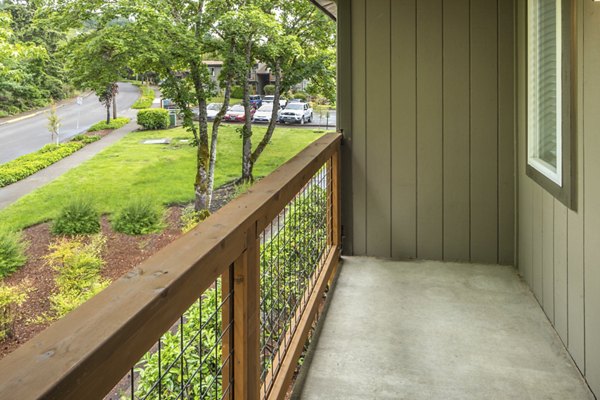 Veri at Timberhill Apartments: Elegant patio with outdoor seating and greenery