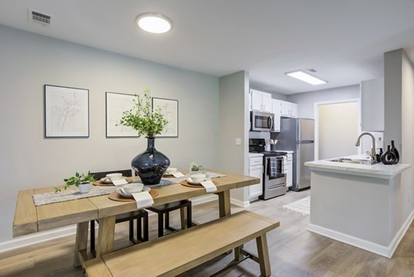 Dining area with modern furnishings and natural lighting at Avana Overlook Apartments, Greystar luxury property
