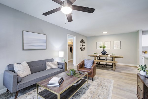 Stylish living room with modern decor at Avana Overlook Apartments, featuring comfortable seating and abundant natural light