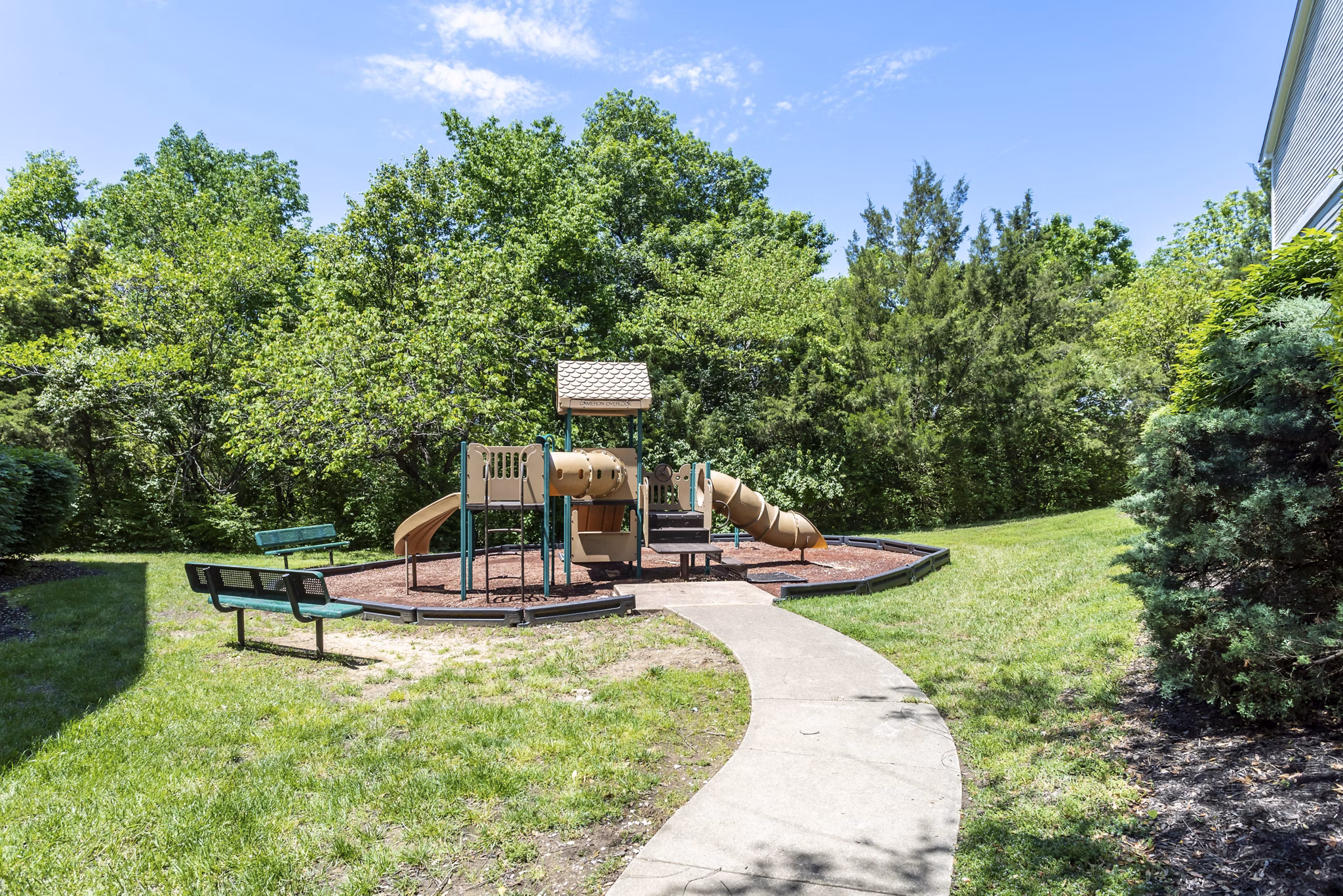 Colorful playground with slides and climbing structures at Avana Overlook Apartments, a family-friendly community for recreation and leisure