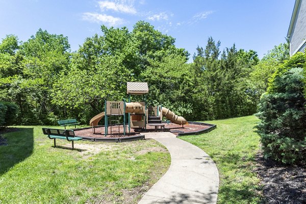 Colorful playground with slides and climbing structures at Avana Overlook Apartments, a family-friendly community for recreation and leisure