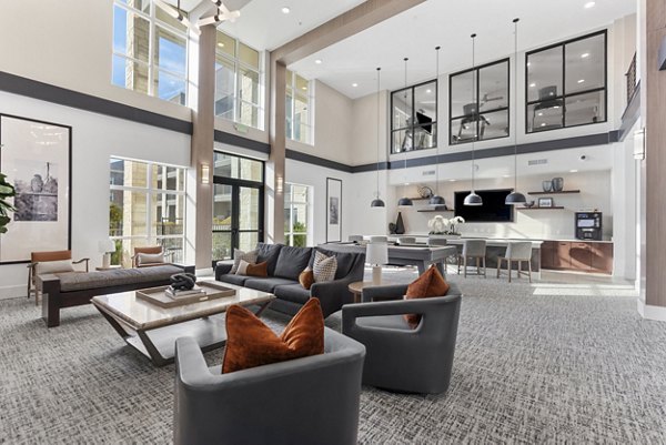 Clubhouse with modern seating and fireplace at The Reflection at Montgomery Ridge apartments
