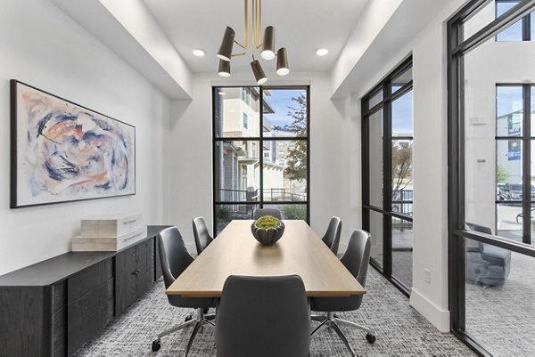 Meeting facility with modern seating and multimedia setup at The Reflection at Montgomery Ridge Apartments