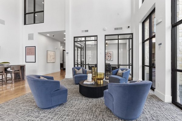 Modern clubhouse with luxurious decor at The Reflection at Montgomery Ridge Apartments