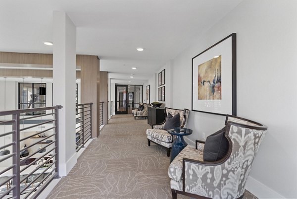 Clubhouse featuring modern design and expansive seating at The Reflection at Montgomery Ridge Apartments in Allen, Texas