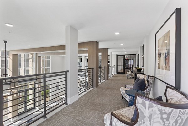 Clubhouse with modern lounge area at The Reflection at Montgomery Ridge Apartments, offering luxury communal spaces for residents