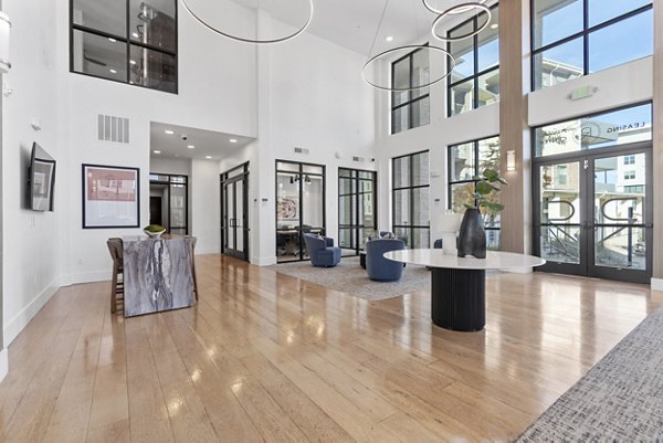 The Reflection at Montgomery Ridge Apartments: Modern clubhouse with elegant furnishings and ample natural light