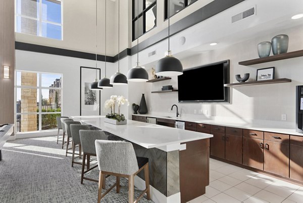 Clubhouse featuring modern design and social lounge at The Reflection at Montgomery Ridge Apartments