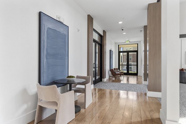 Clubhouse featuring modern decor and luxurious seating at The Reflection at Montgomery Ridge Apartments