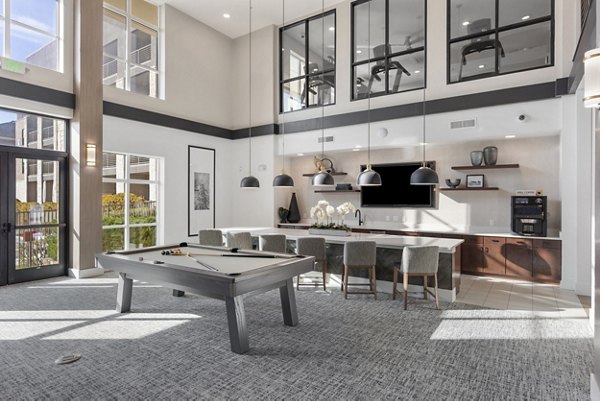 The Reflection at Montgomery Ridge: Modern clubhouse featuring leisure spaces and contemporary design in a luxury apartment community
