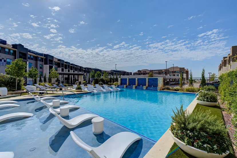 Resort-style outdoor pool at The Reflection at Montgomery Ridge Apartments offering luxury living in a serene environment