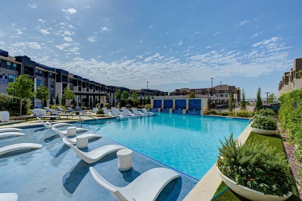 Resort-style outdoor pool at The Reflection at Montgomery Ridge Apartments offering luxury living in a serene environment