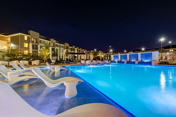 Infinity-edge pool at The Reflection at Montgomery Ridge Apartments offering luxury relaxation and stunning views