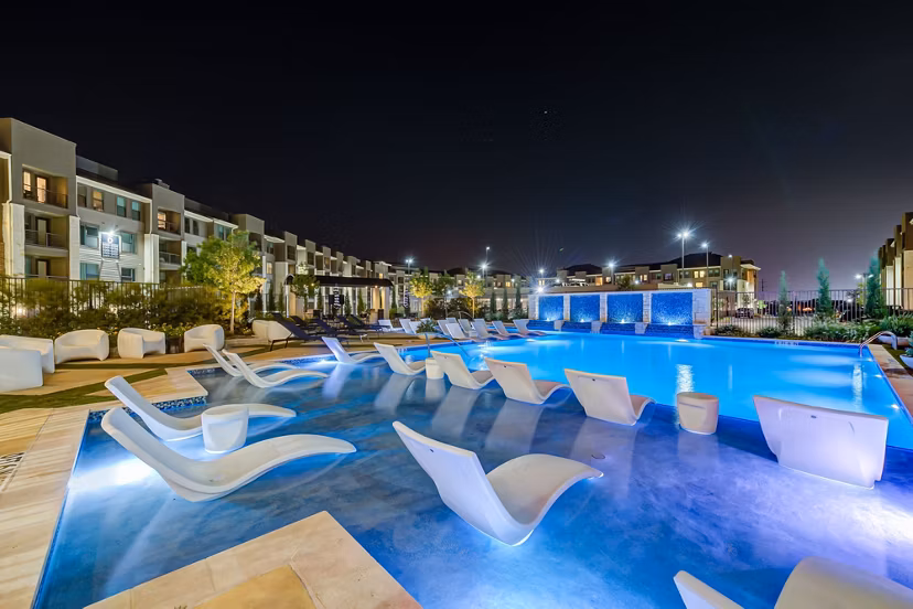 Relaxing poolside retreat at The Reflection at Montgomery Ridge Apartments, offering luxury leisure amenities for residents