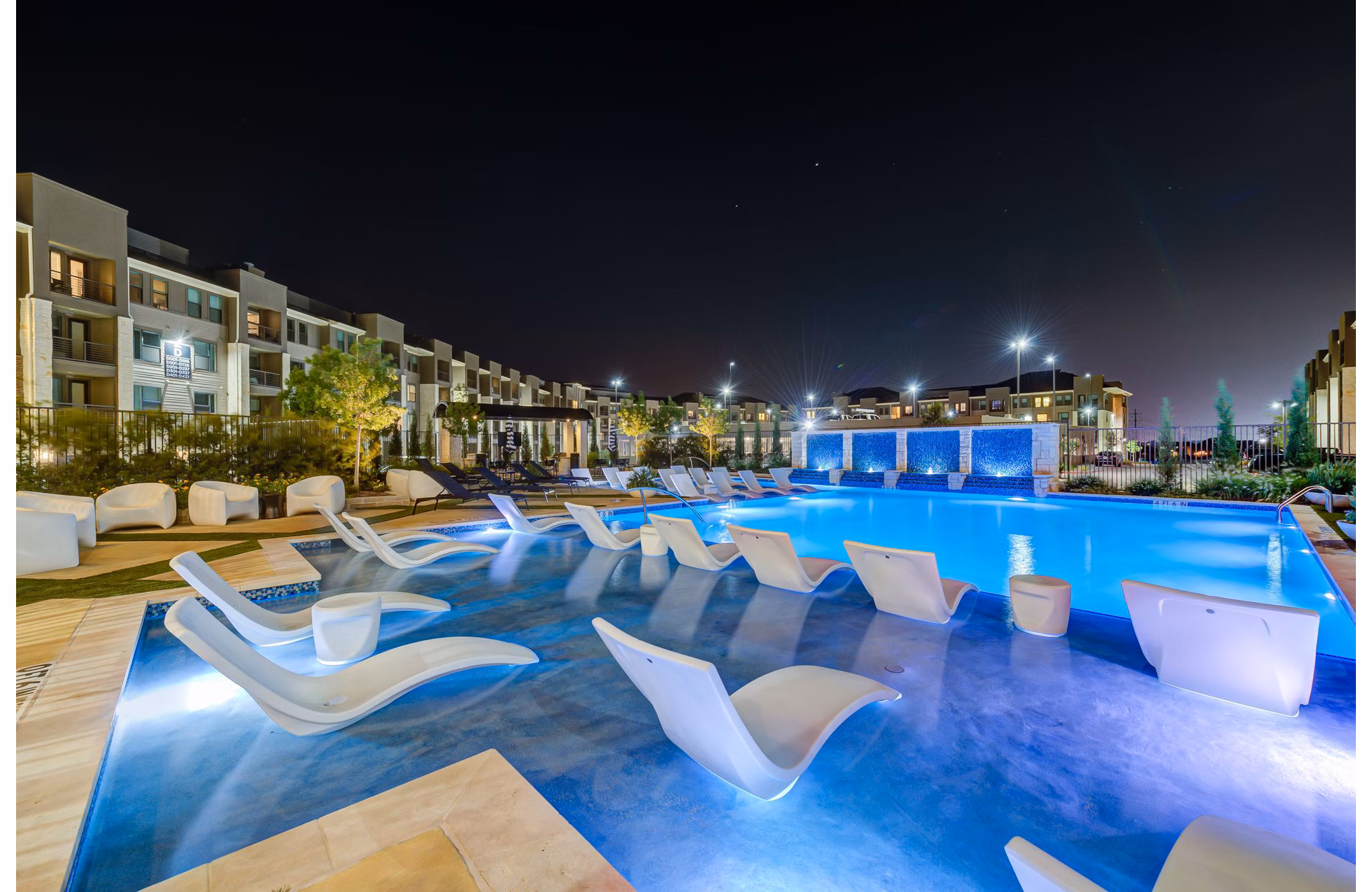 Relaxing poolside retreat at The Reflection at Montgomery Ridge Apartments, offering luxury leisure amenities for residents