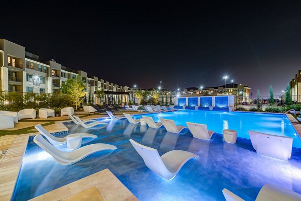 Relaxing poolside retreat at The Reflection at Montgomery Ridge Apartments, offering luxury leisure amenities for residents