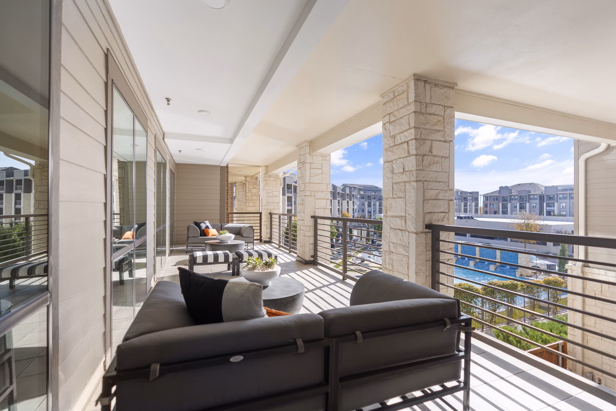 Chic patio seating area at The Reflection at Montgomery Ridge Apartments offering luxury outdoor relaxation space