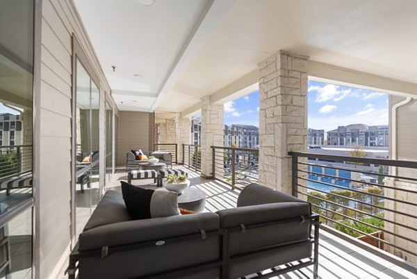 Chic patio seating area at The Reflection at Montgomery Ridge Apartments offering luxury outdoor relaxation space