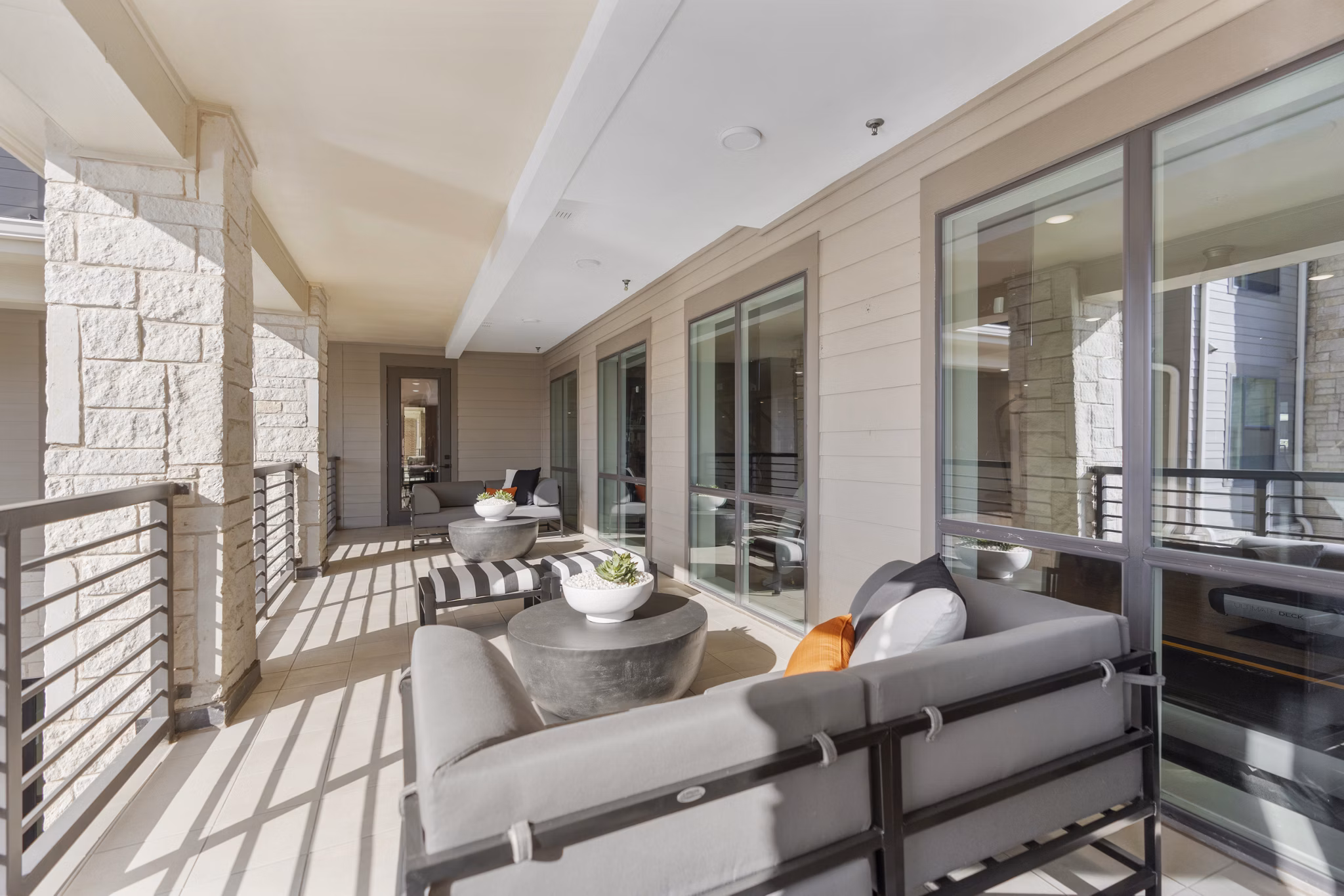 Cozy patio with outdoor seating at The Reflection at Montgomery Ridge Apartments, perfect for relaxation and social gatherings