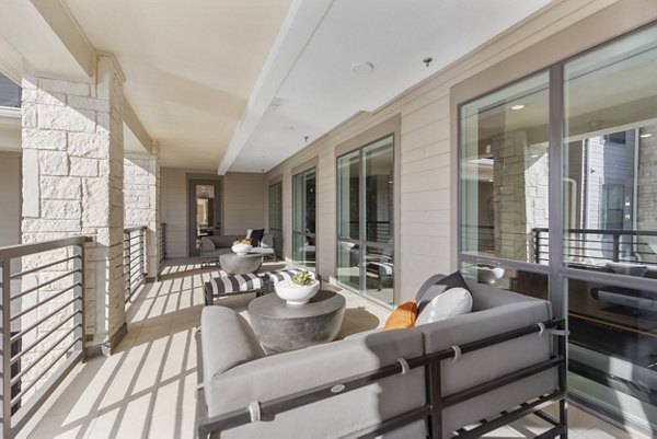 Cozy patio with outdoor seating at The Reflection at Montgomery Ridge Apartments, perfect for relaxation and social gatherings