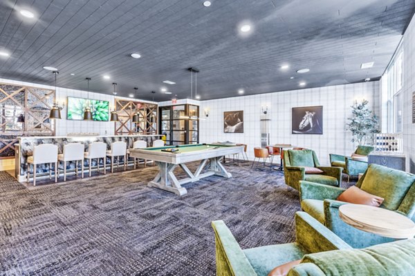 Clubhouse featuring modern design and cozy seating at Canter Green Apartments