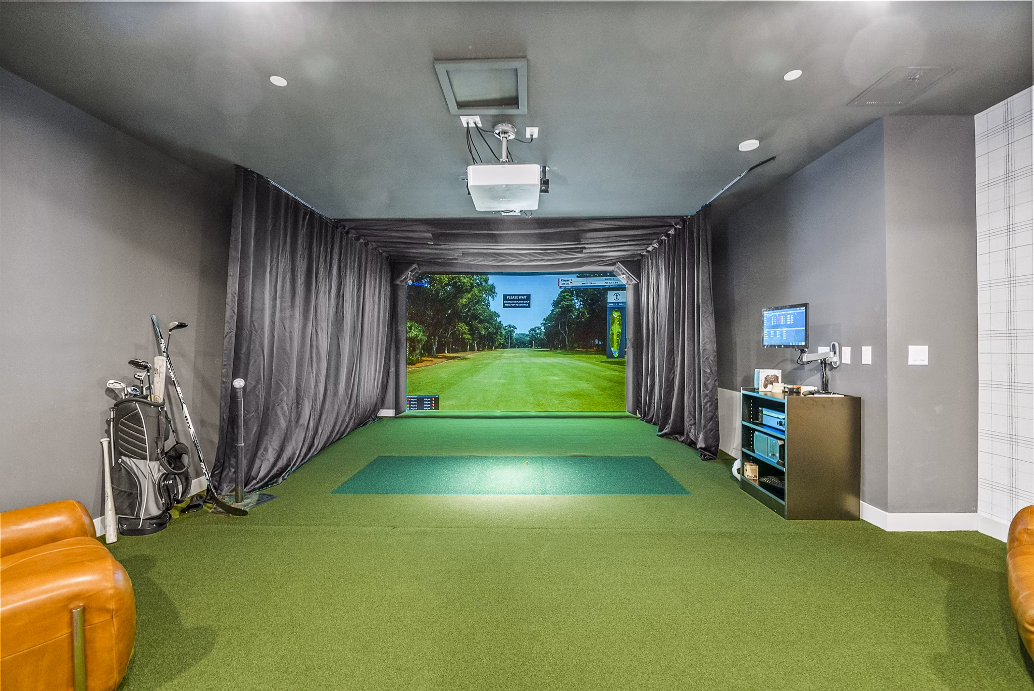 Modern virtual golf driving range at Canter Green Apartments with advanced simulation technology, perfect for golf enthusiasts