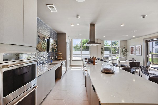 Clubhouse interior featuring modern seating and entertainment space at Canter Green Apartments, luxurious living by Greystar